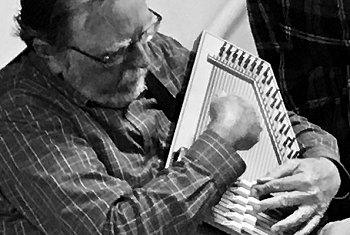 Paul Race playing a yellow Type A 15-chorder at a Yellow Springs Hootnanny, about 2019.  Click for bigger picture.